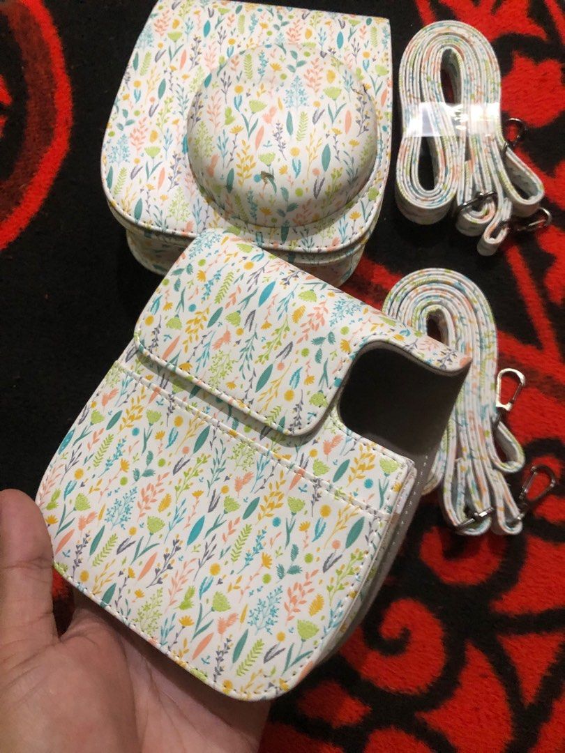 Instax mini leather padded cases (Category: Camera Bags & Carriers) located in Quezon City. Submitted by markgolveo (Listing ID 1396347959, Image 1). Description: Instax mini leather padded cases 2 pieces as set pair One piece of the pair has chip issue in front Both has slings strap intact Other piece is as good as new.
