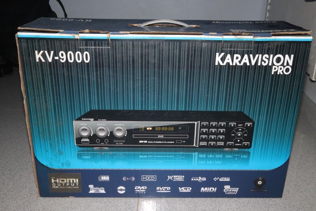 Karavision Pro KV-9000 Karaoke Player (Category: Blu-Ray & Media Players) located in Quezon City. Submitted by mabait_na_posa (Listing ID 1396435533, Image 1). Description: RFS: Decluttering Original Price: ₱4500 with receipt - Pre-owned, good working condition - With 2 wired microphones - Inputs: USB, SD card, AUX in, mic jack Inclusions - Karaoke Player - 2x Wired Microphone - Remote - 3 Karaoke CD/DVD - 1 Songbook - Composite Cable Open for me