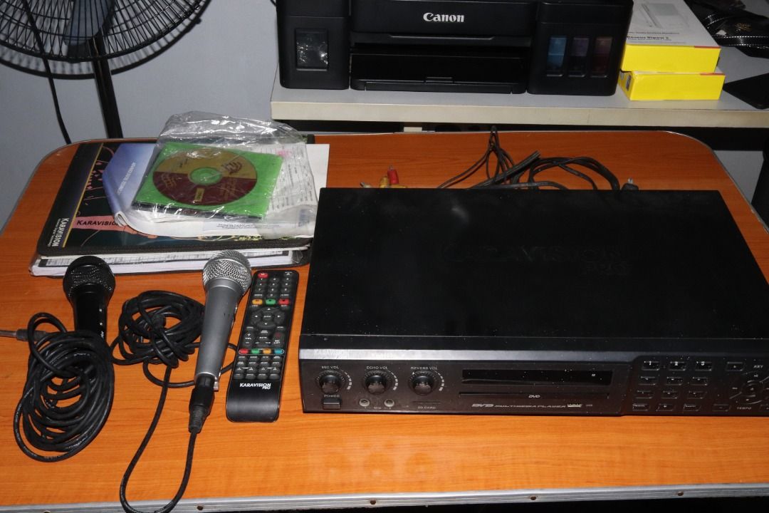 Karavision Pro KV-9000 Karaoke Player (Category: Blu-Ray & Media Players) located in Quezon City. Submitted by mabait_na_posa (Listing ID 1396435533, Image 2). Description: RFS: Decluttering Original Price: ₱4500 with receipt - Pre-owned, good working condition - With 2 wired microphones - Inputs: USB, SD card, AUX in, mic jack Inclusions - Karaoke Player - 2x Wired Microphone - Remote - 3 Karaoke CD/DVD - 1 Songbook - Composite Cable Open for me