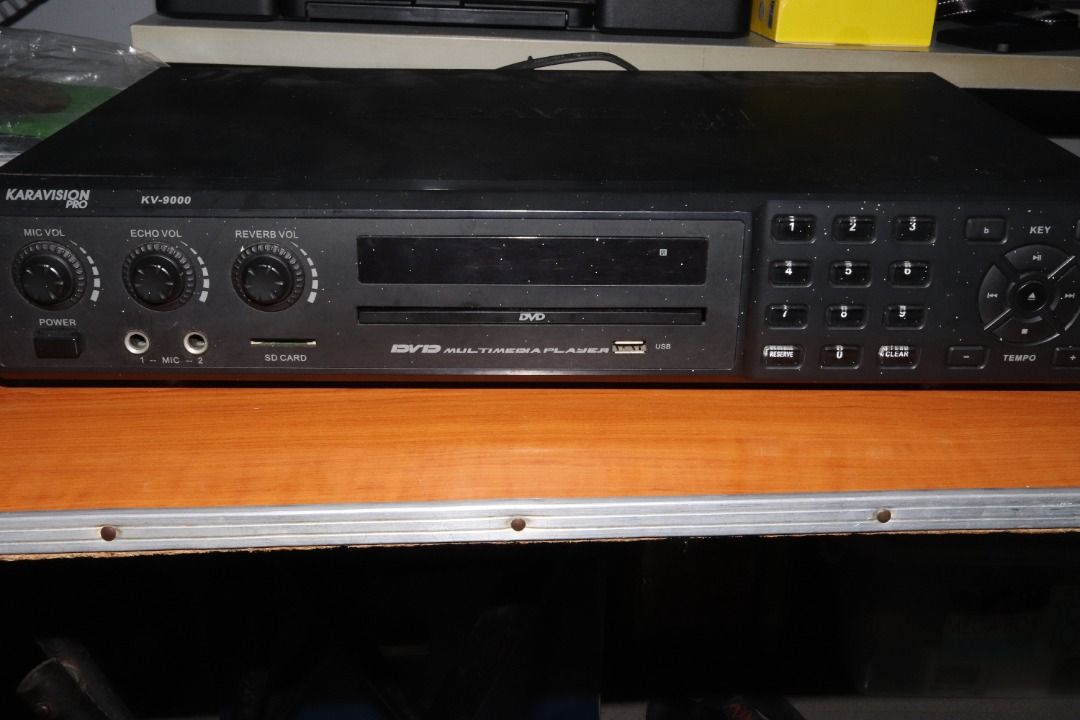 Karavision Pro KV-9000 Karaoke Player (Category: Blu-Ray & Media Players) located in Quezon City. Submitted by mabait_na_posa (Listing ID 1396435533, Image 3). Description: RFS: Decluttering Original Price: ₱4500 with receipt - Pre-owned, good working condition - With 2 wired microphones - Inputs: USB, SD card, AUX in, mic jack Inclusions - Karaoke Player - 2x Wired Microphone - Remote - 3 Karaoke CD/DVD - 1 Songbook - Composite Cable Open for me