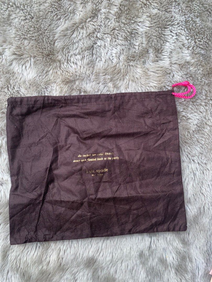 (5% off)❣️ Kate Spade Dust Bag (Category: Luxury Bags & Wallets) located in Manila. Submitted by avathriftedcloset (Listing ID 1396445221, Image 1). Description: - Authentic Kate Spade dust bag - Brown color with pink drawstring - Features the Kate Spade logo and a quote - Protects your Kate Spade bags - Perfect for storage.