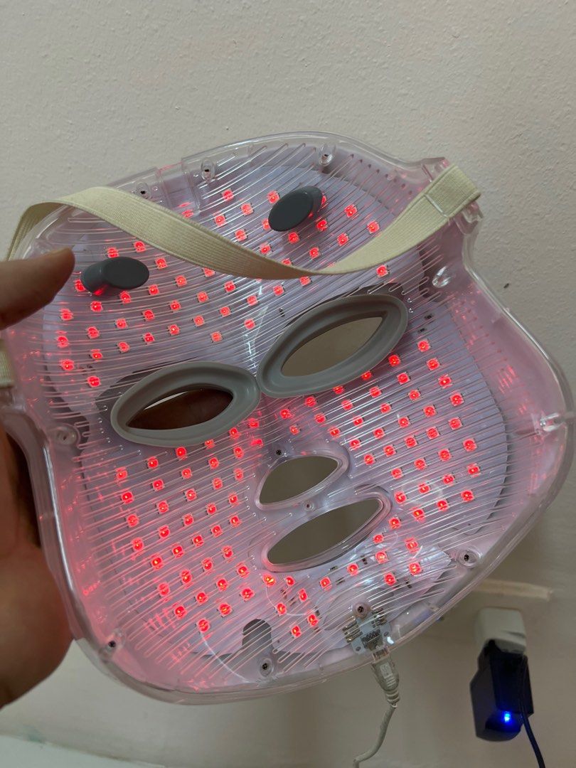 LED Face Mask with Multiple Light Settings (Category: Face Care) located in Taguig. Submitted by r_m_g (Listing ID 1396313765, Image 2). Description: - LED face mask for targeted skincare. - Features multiple light settings: green, red, and blue. - Comfortable and flexible design. - Adjustable strap for a perfect fit. - Plugs into a standard outlet. - In good working condition..