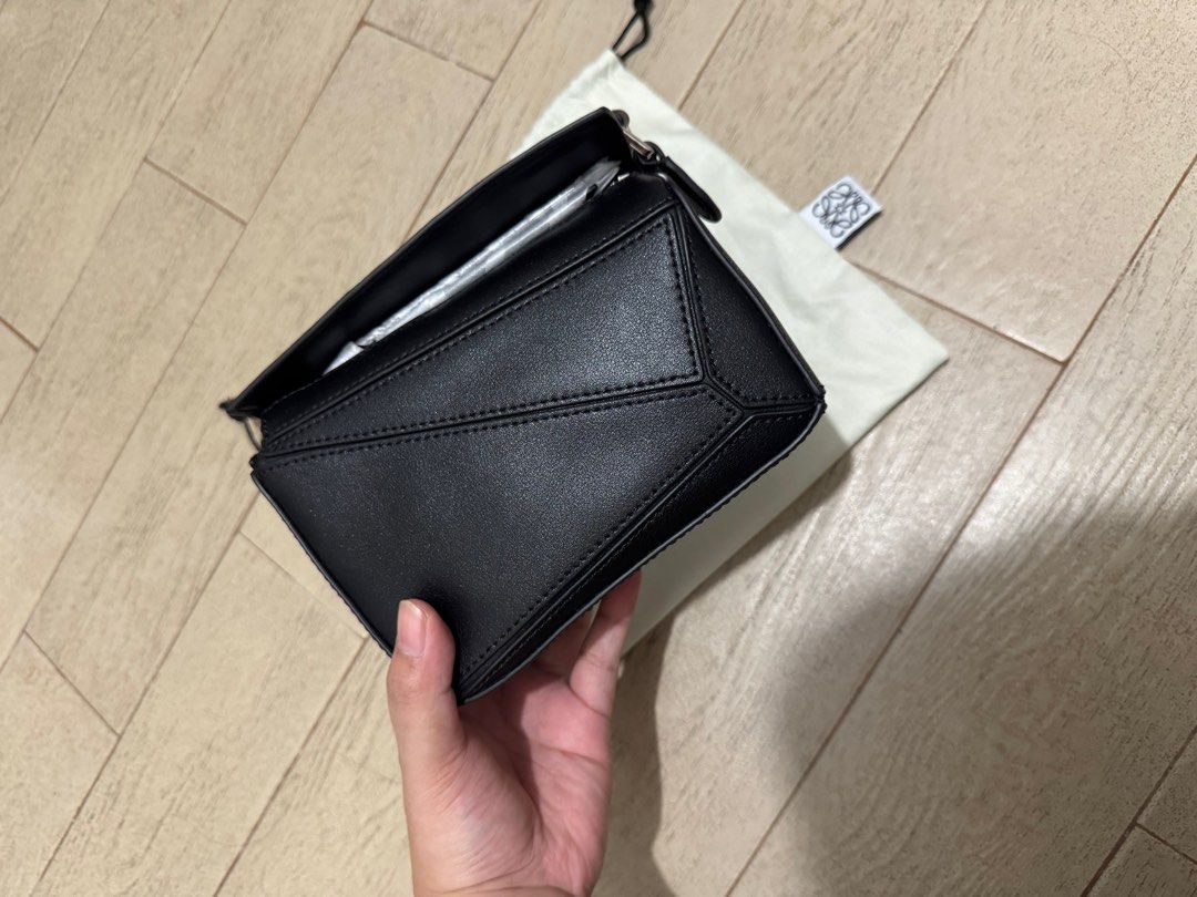 LOEWE MINI PUZZLE BAG (Category: Luxury Bags & Wallets) located in Quezon City. Submitted by glamfashionboutique (Listing ID 1396338714, Image 1). Description: Loewe Puzzle bag that everyones raving about! Comes with dustbag, strap, box Used twice but like new I have other loewe soo selling my other one Help me from decluttering.