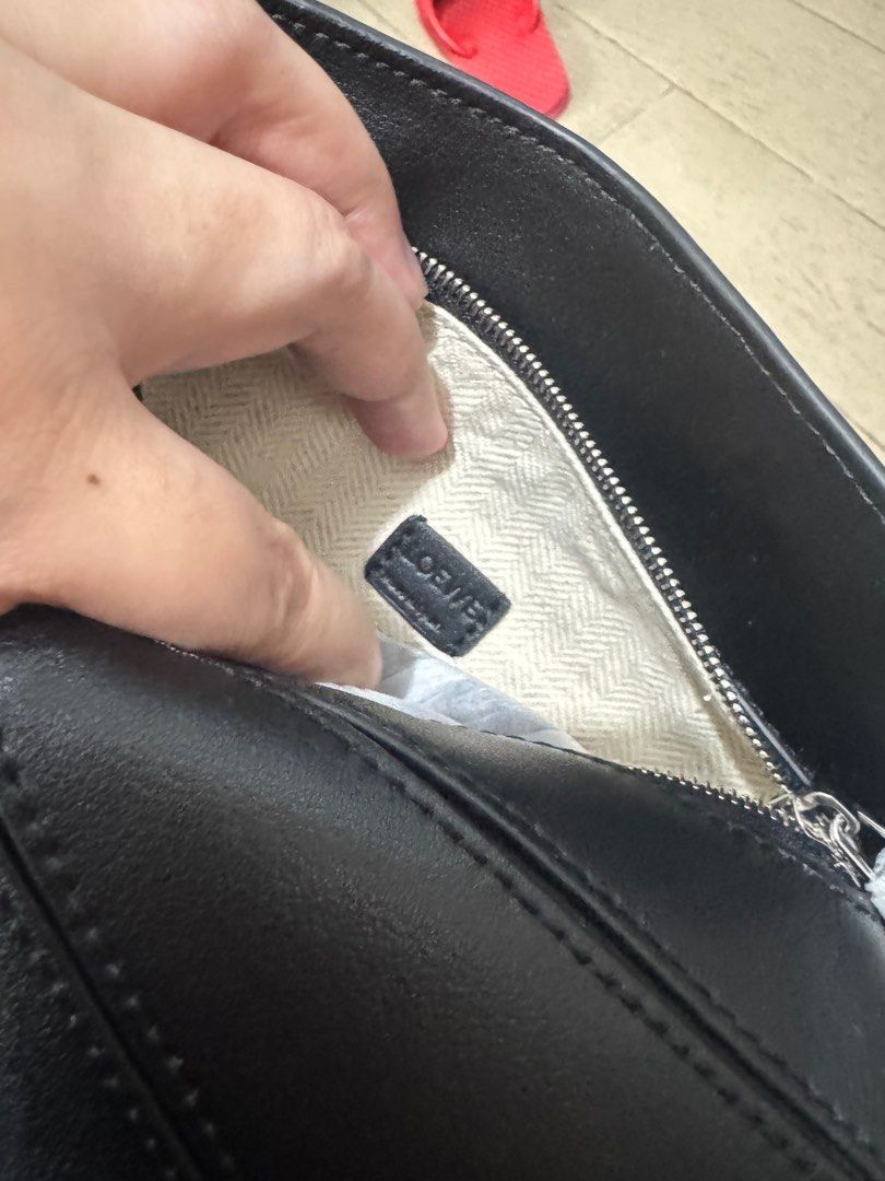LOEWE MINI PUZZLE BAG (Category: Luxury Bags & Wallets) located in Quezon City. Submitted by glamfashionboutique (Listing ID 1396338714, Image 3). Description: Loewe Puzzle bag that everyones raving about! Comes with dustbag, strap, box Used twice but like new I have other loewe soo selling my other one Help me from decluttering.