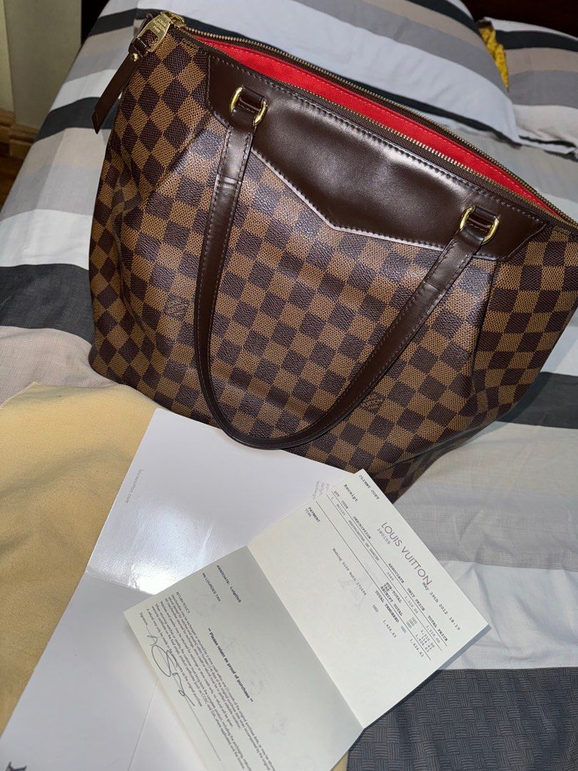Louis Vuitton Westminster GM Damier Bag (Category: Luxury Bags & Wallets) located in Quezon City. Submitted by unclutter_ (Listing ID 1396313291, Image 2). Description: - Authentic Louis Vuitton Westminster GM Damier (with receipts) - Brown leather trim and handles - Red fabric interior lining - Includes receipt and dust bag - Secure zipper closure - Elegant gold-tone hardware.