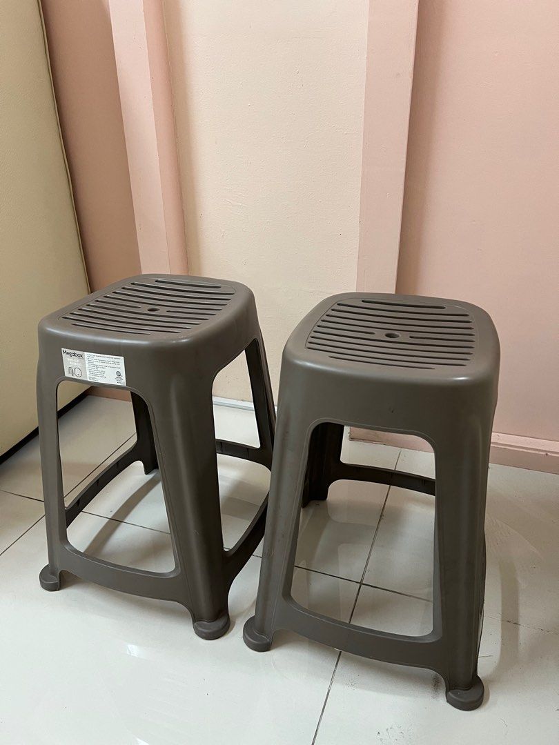 Megabox Plastic Stools (Category: Chairs) located in Taguig. Submitted by r_m_g (Listing ID 1396312516, Image 1). Description: - Set of 2 Megabox plastic stools - Color: Brown - Seat: Rectangular with slotted design - Features: Stackable for convenient storage - Suitable for: Indoor and outdoor use - Base: Sturdy four-legged design.