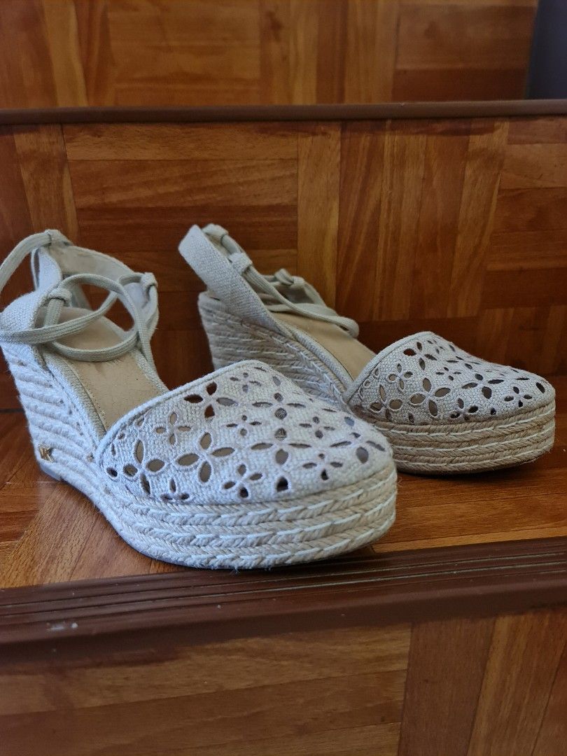 Michael Kors Darci Espadrille Wedges (Category: Wedges) located in Sibulan. Submitted by classy.potato (Listing ID 1396291152, Image 3). Description: - Michael Kors espadrille wedges - Beige color - Woven platform sole - Floral cut-out toe design - Lace-up closure - Ankle strap - MK logo detail.
