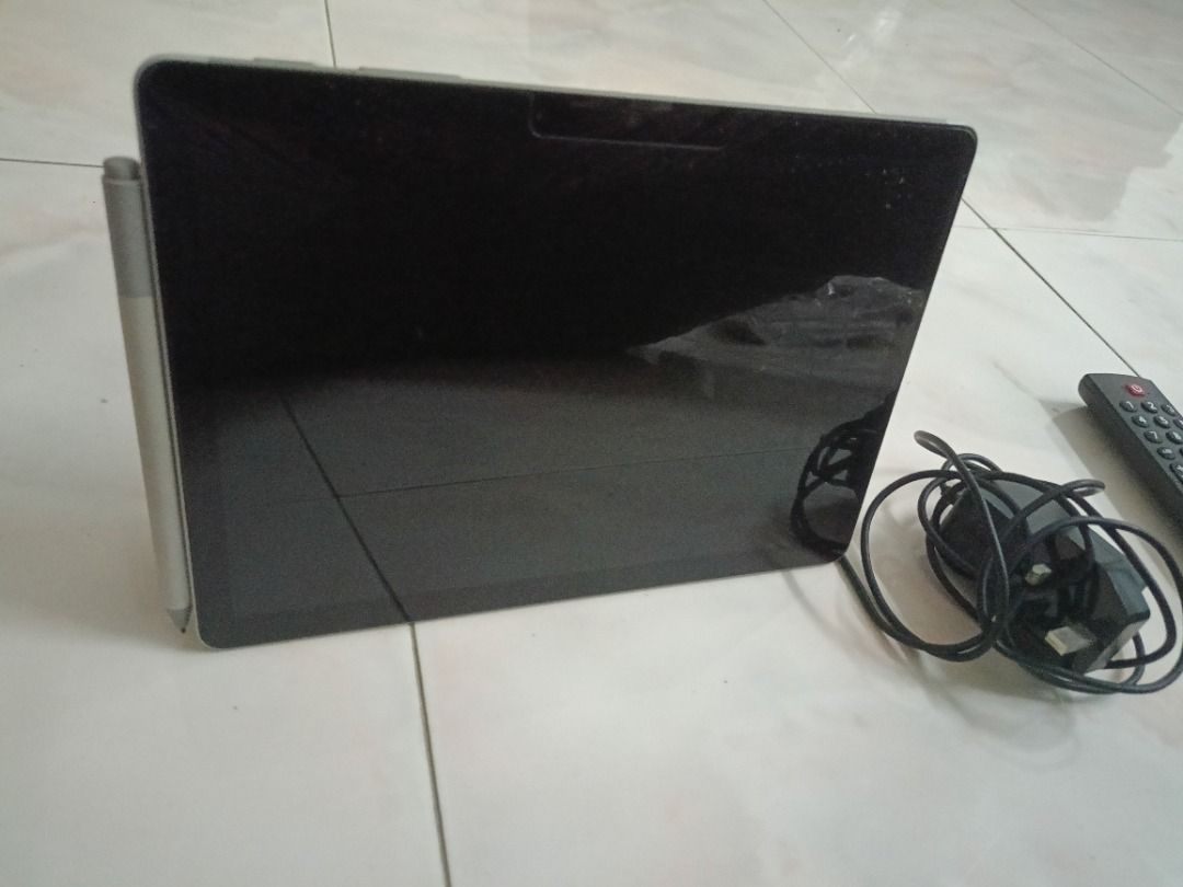 Surface Microsoft Tablet (Category: Windows) located in Kuala Lumpur. Submitted by tenfeet (Listing ID 1396422248, Image 3). Description: - Microsoft Surface tablet - Includes stylus and charger - 4GB RAM - Windows 11 Home - 64-bit operating system - Silver color - Black screen has tiny scratch .