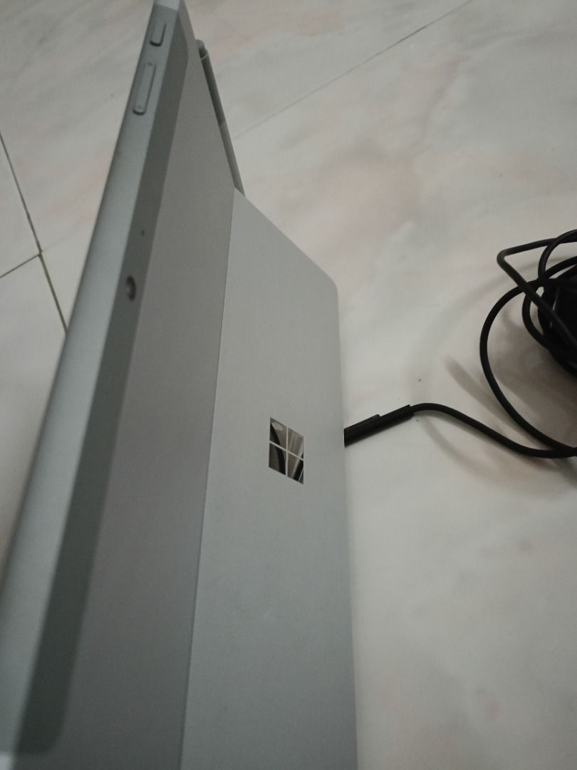 Surface Microsoft Tablet (Category: Windows) located in Kuala Lumpur. Submitted by tenfeet (Listing ID 1396422248, Image 1). Description: - Microsoft Surface tablet - Includes stylus and charger - 4GB RAM - Windows 11 Home - 64-bit operating system - Silver color - Black screen has tiny scratch .