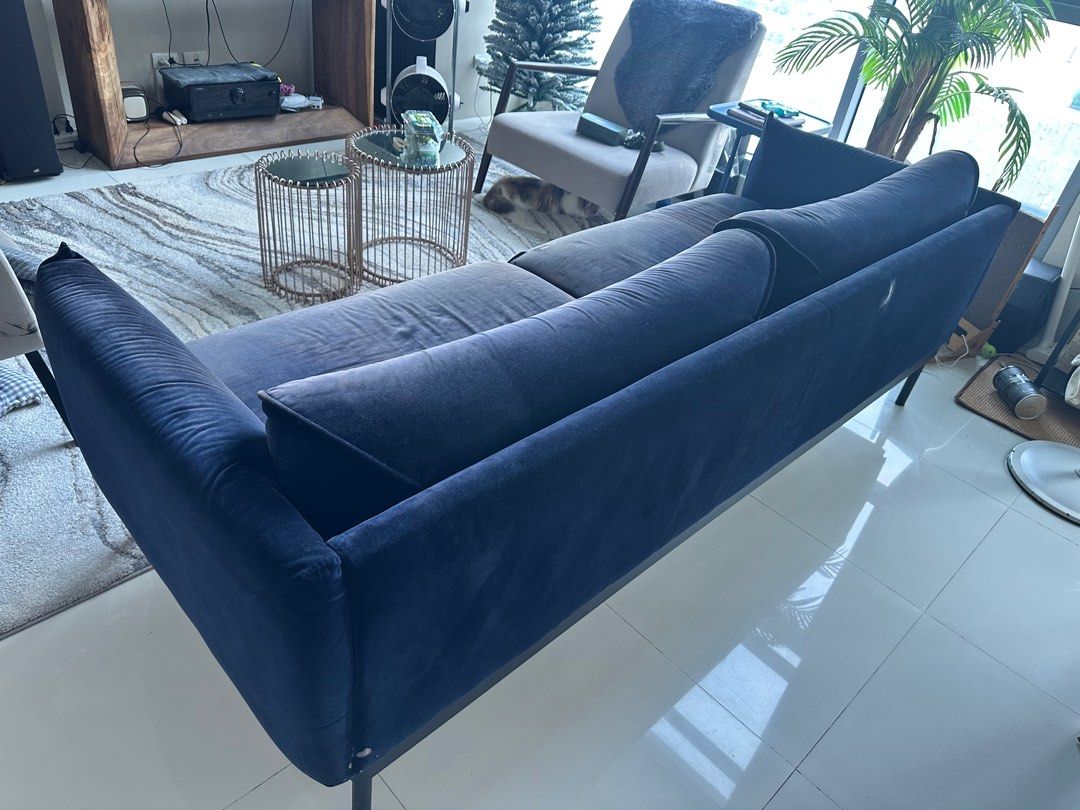 Navy Blue Velvet Sofa (Category: Sofas) located in Manila. Submitted by thriftyfindshub (Listing ID 1396308855, Image 3). Description: - Navy blue velvet sofa - Modern, low-profile design - Sleek black legs - Includes two seat cushions and two bolster pillows - Well-maintained condition.