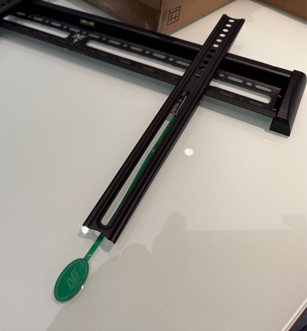 NB Ultra-Thin TV Wall Mount Bracket (Category: TV Parts & Accessories) located in Taguig. Submitted by tepperseller (Listing ID 1396376061, Image 2). Description: Ultra-thin TV wall mount bracket. Supports heavy TVs safely. Includes all necessary components for installation. The main bracket has a built-in level. Compatible with 75/86/98/100 inch TVs. The bracket is black in color. 27.5" long x 4" height .