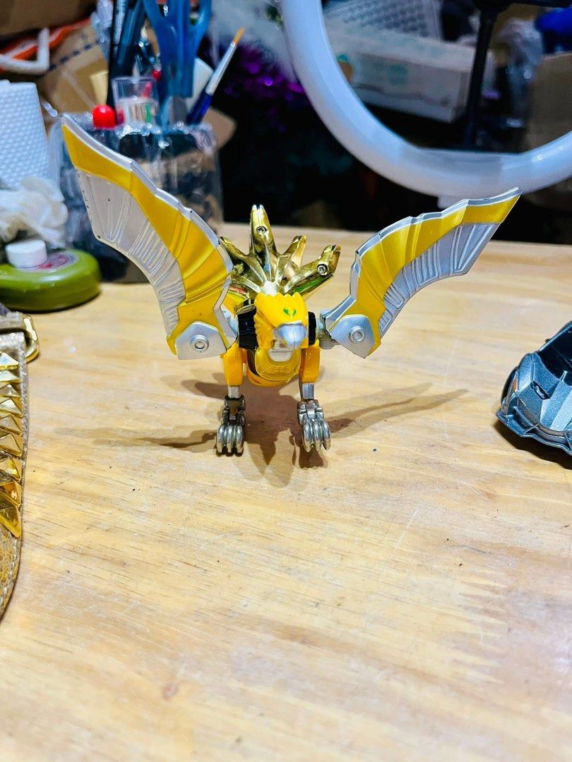 Power Rangers Wild Force - Predazord (Category: Action & Battle Toys) located in Pilar. Submitted by faveanyshop (Listing ID 1396436783, Image 1). Description: - Predazord toy from Power Rangers Wild Force. - Color scheme: Yellow, silver, and gold. - Bird-like design with articulated wings. - Detailed head. - Perfect for Power Rangers collectors..