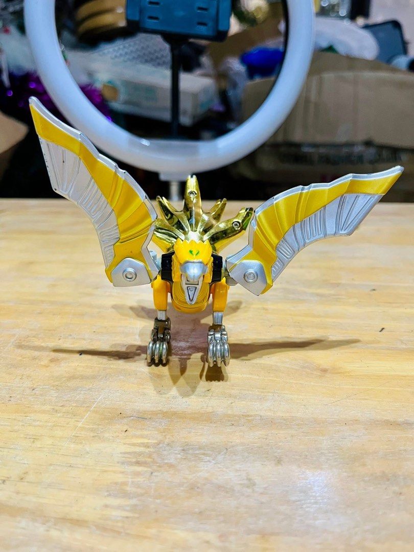 Power Rangers Wild Force - Predazord (Category: Action & Battle Toys) located in Pilar. Submitted by faveanyshop (Listing ID 1396436783, Image 3). Description: - Predazord toy from Power Rangers Wild Force. - Color scheme: Yellow, silver, and gold. - Bird-like design with articulated wings. - Detailed head. - Perfect for Power Rangers collectors..