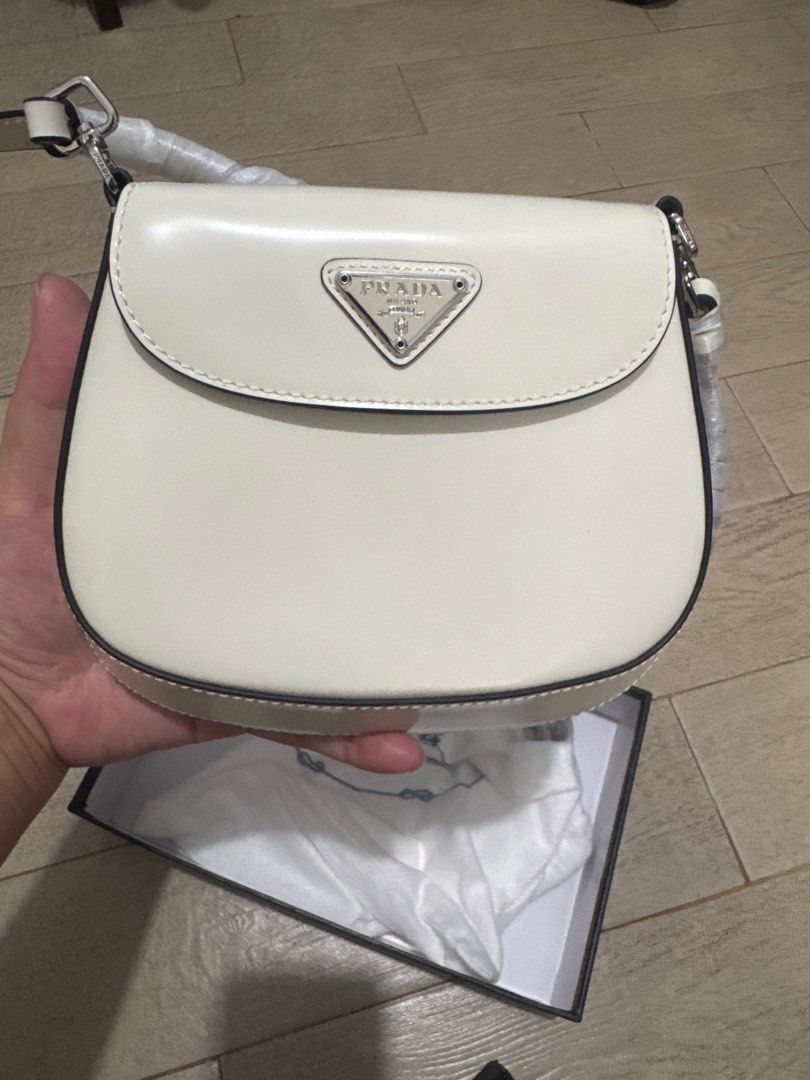 PRADA CLEO BAG (Category: Luxury Bags & Wallets) located in Quezon City. Submitted by glamfashionboutique (Listing ID 1396337062, Image 3). Description: PRADA CLEO BAG Can be worn as shoulder bag or kili bag Comes with shoulder strap, box, prada pouch Sourced from Japan Secondhand but like new Only once during event .