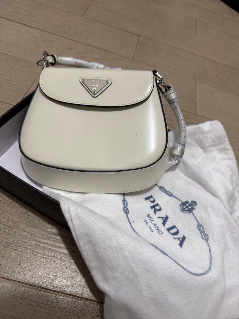PRADA CLEO BAG (Category: Luxury Bags & Wallets) located in Quezon City. Submitted by glamfashionboutique (Listing ID 1396337062, Image 1). Description: PRADA CLEO BAG Can be worn as shoulder bag or kili bag Comes with shoulder strap, box, prada pouch Sourced from Japan Secondhand but like new Only once during event .