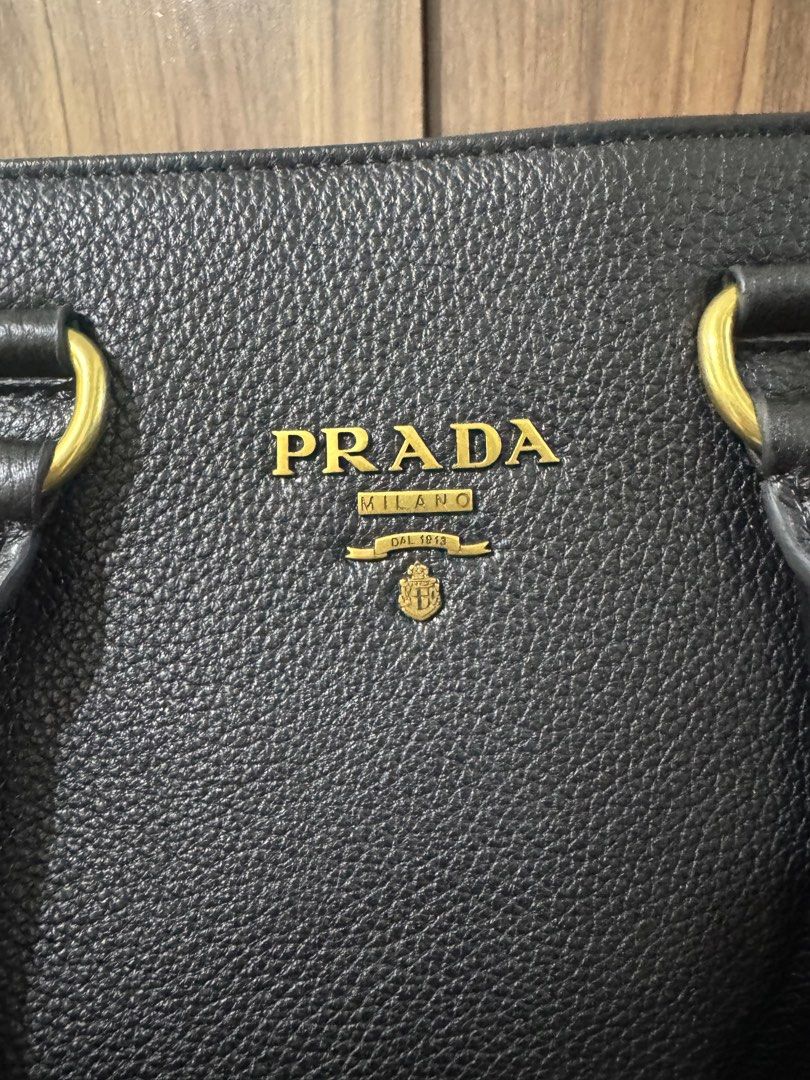 PRADA LEATHER TOTE BAG (Category: Luxury Bags & Wallets) located in Quezon City. Submitted by glamfashionboutique (Listing ID 1396340131, Image 2). Description: Prada Tote Bag Leather type Can fit your laptop and be used as work bag, handbag or shoulder ag Comes with long strap and with dustbag Saffiano leather .