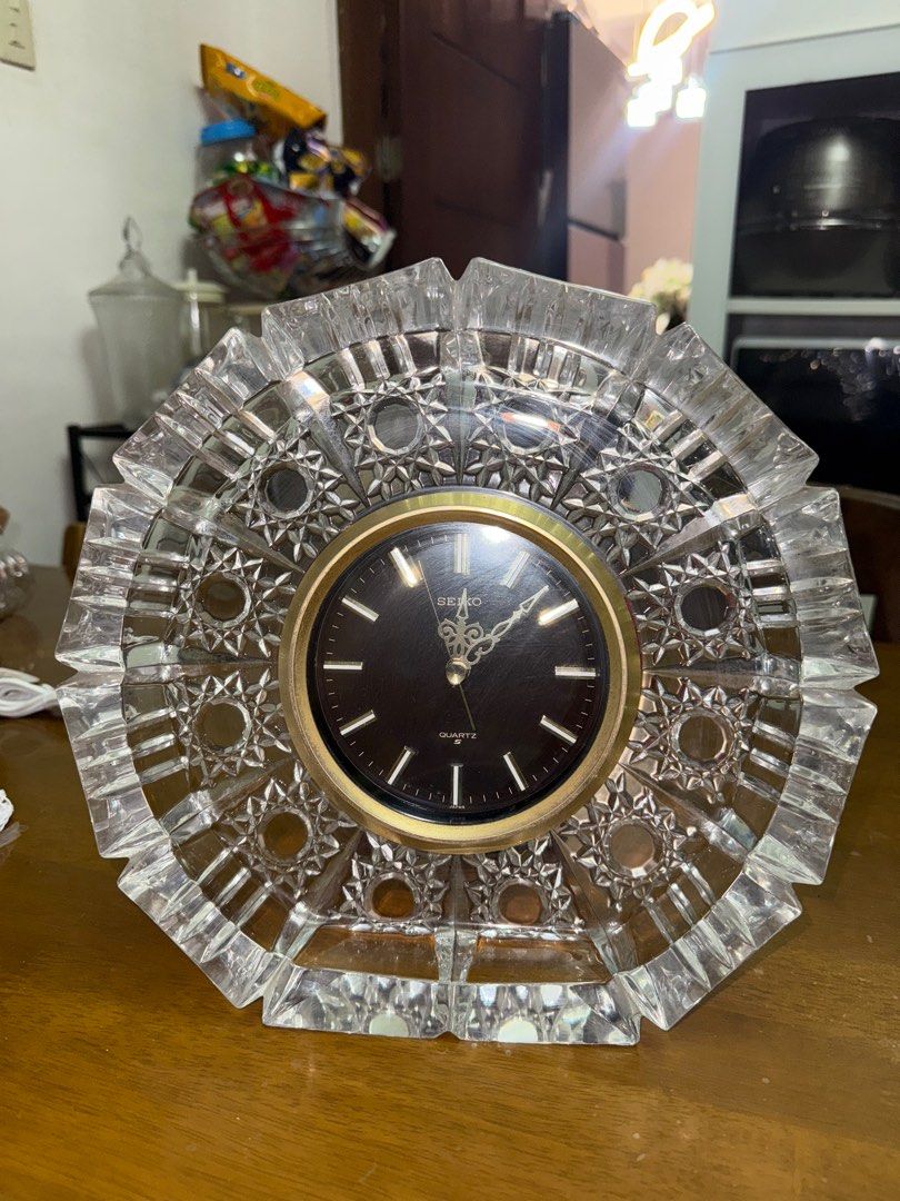 Seiko Quartz Crystal Clock (Category: Clocks) located in Pilar. Submitted by faveanyshop (Listing ID 1396444087, Image 3). Description: - Seiko quartz clock - Crystal design - Black clock face with gold accents - Unique, faceted crystal frame - Good working condition - Perfect for home decor.