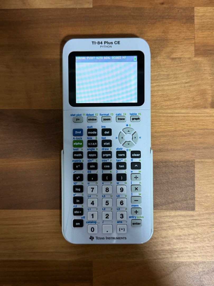 TI-84 Plus CE Python (White) (Category: Stationery & School Supplies) located in Singapore. Submitted by foreverbjorn (Listing ID 1396437730, Image 2). Description: Condition: 9.9/10 No scratches or damages. In pristine condition! Selling as my university does not permit graphing calculators. Comes with charging cable..
