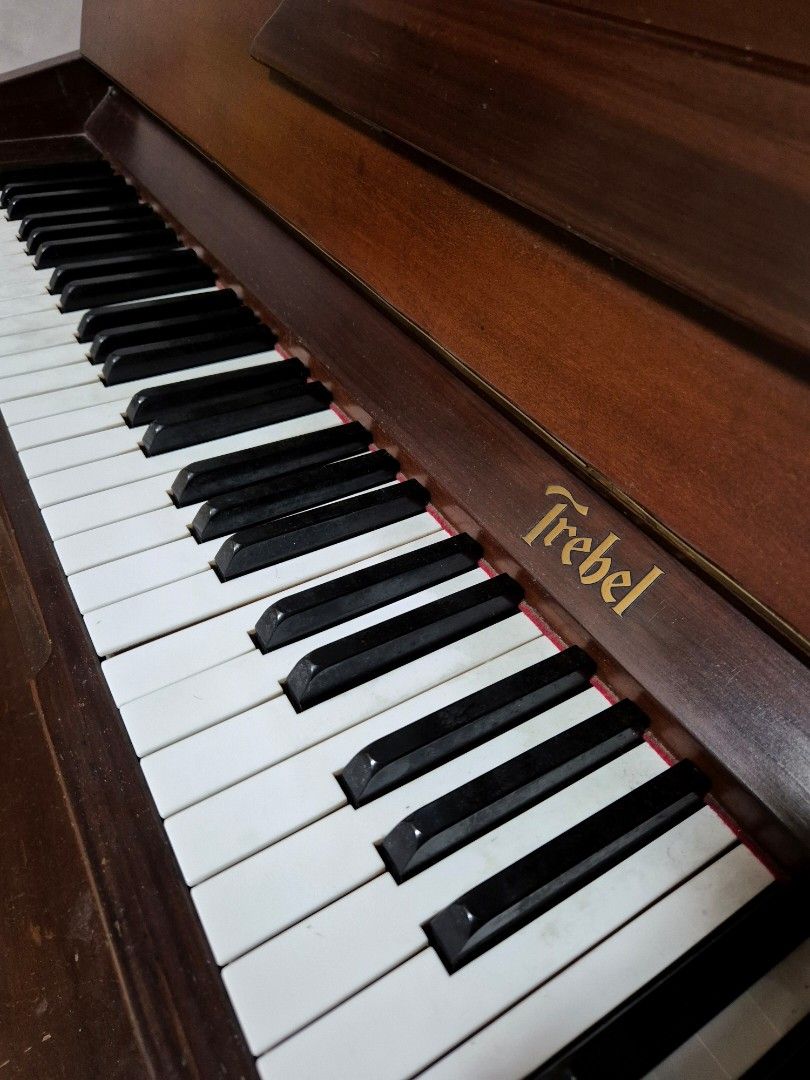 Trebel Piano (Category: Musical Instruments) located in Quezon City. Submitted by pluve.arce06210 (Listing ID 1396289396, Image 1). Description: - Trebel Vertipremium piano - Dark wood finish - Classic design - Black and white keys - Includes matching wooden bench - Trebel logo visible Trebel upright piano May keys na out of tune, di pa napapatono Bought 2007 As is condition, di nagagamit With chair na kasama For pick up only (near Lagro QC) Pric