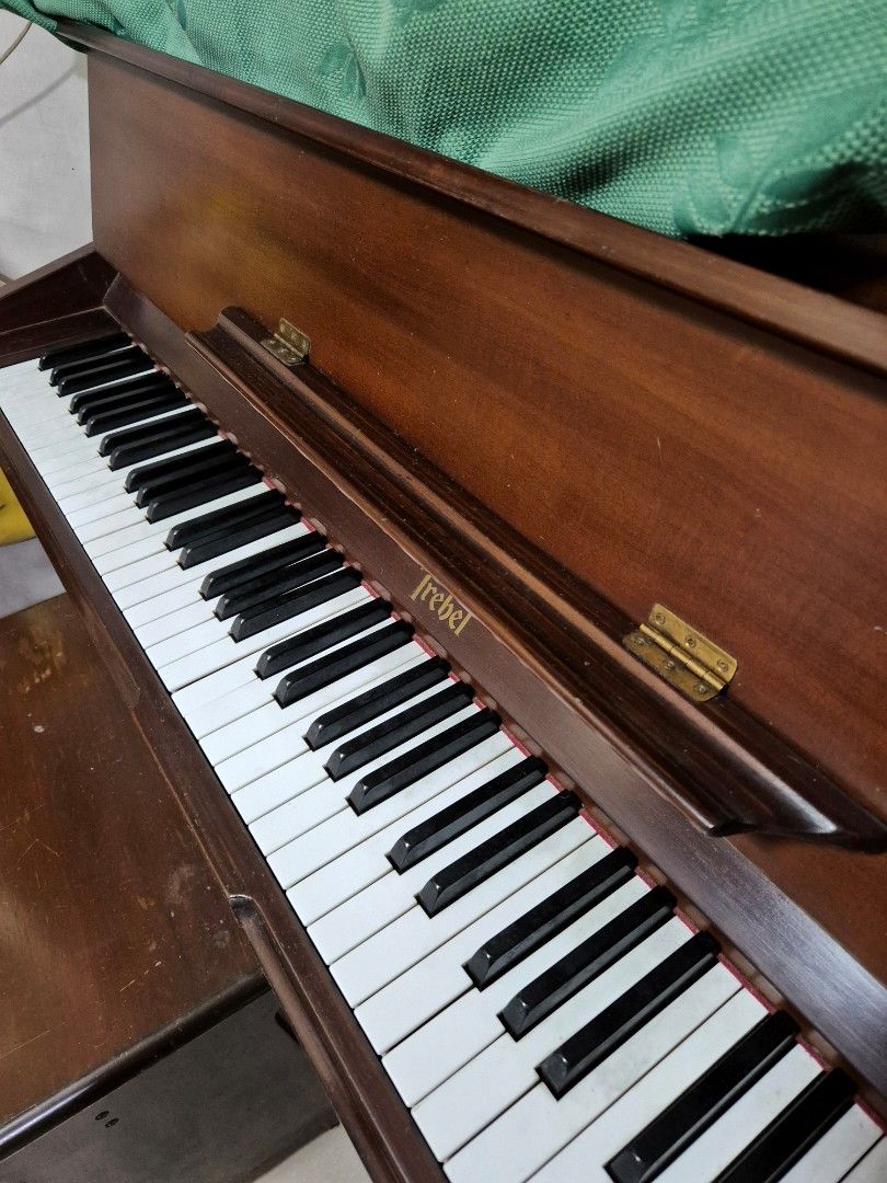 Trebel Piano (Category: Musical Instruments) located in Quezon City. Submitted by pluve.arce06210 (Listing ID 1396289396, Image 2). Description: - Trebel Vertipremium piano - Dark wood finish - Classic design - Black and white keys - Includes matching wooden bench - Trebel logo visible Trebel upright piano May keys na out of tune, di pa napapatono Bought 2007 As is condition, di nagagamit With chair na kasama For pick up only (near Lagro QC) Pric