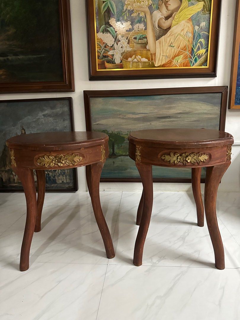 Vintage Narra side table pair (Category: Tables & Sets) located in Quezon City. Submitted by anjherga27 (Listing ID 1396339668, Image 3). Description: - Set of two vintage side tables - Wooden construction - Unique shapes with curved legs - Decorative gold accents - Rich brown tabletops - Perfect for decor or drinks - Charming addition to any living space.