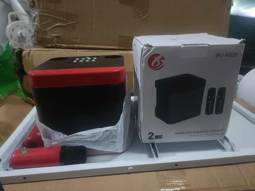 WJ-A826 Wireless Karaoke Speaker (Category: Soundbars, Speakers & Amplifiers) located in Malabon City. Submitted by granmerlencagayandeoro (Listing ID 1396440857, Image 1). Description: - Wireless karaoke speaker - Model: WJ-A826 - Color: Black and Red - Includes two microphones - Complete set, ready to use.