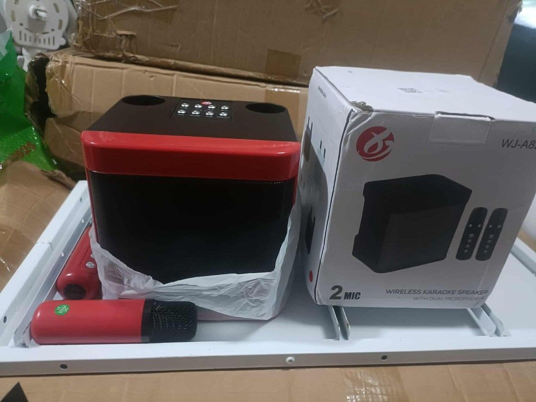 WJ-A826 Wireless Karaoke Speaker (Category: Soundbars, Speakers & Amplifiers) located in Malabon City. Submitted by granmerlencagayandeoro (Listing ID 1396440857, Image 2). Description: - Wireless karaoke speaker - Model: WJ-A826 - Color: Black and Red - Includes two microphones - Complete set, ready to use.