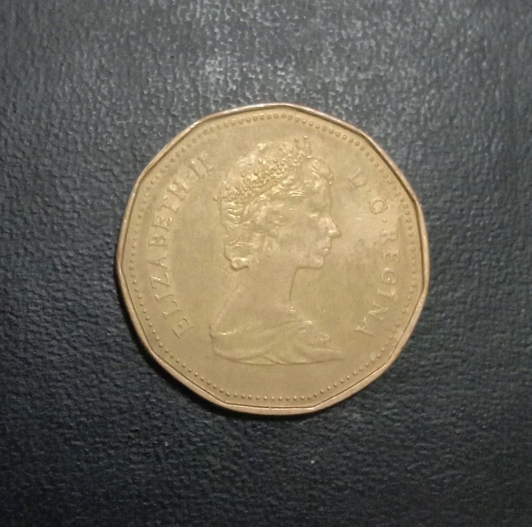 1987 Queen Elizabeth Canada Dollar Coin (Category: Currency) located in Cabuyao City. Submitted by reyesjim60 (Listing ID 1396602043, Image 2). Description: 1987 Queen Elizabeth Canada Dollar Coin.