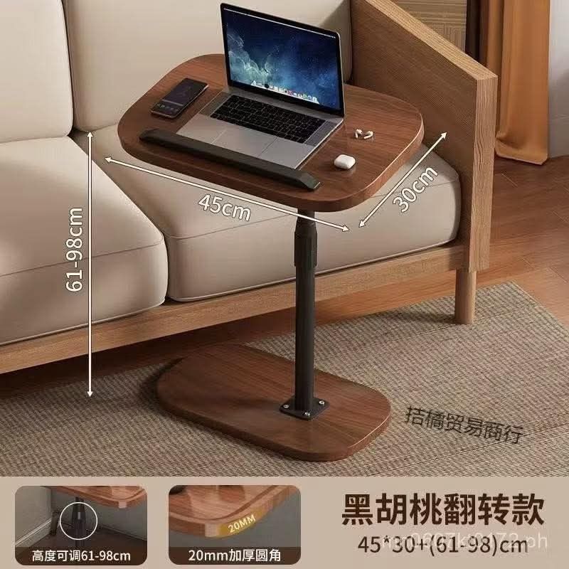 Adjustable Laptop Table (Category: Tables & Sets) located in Manila. Submitted by lyfrancois14 (Listing ID 1396499365, Image 2). Description: - Adjustable laptop table - Dark wood finish with black base - Height adjustable: 61-98cm - Tabletop size: 45cm x 30cm - Rounded edge design - 20mm thickness - Ideal for use beside sofa or bed.
