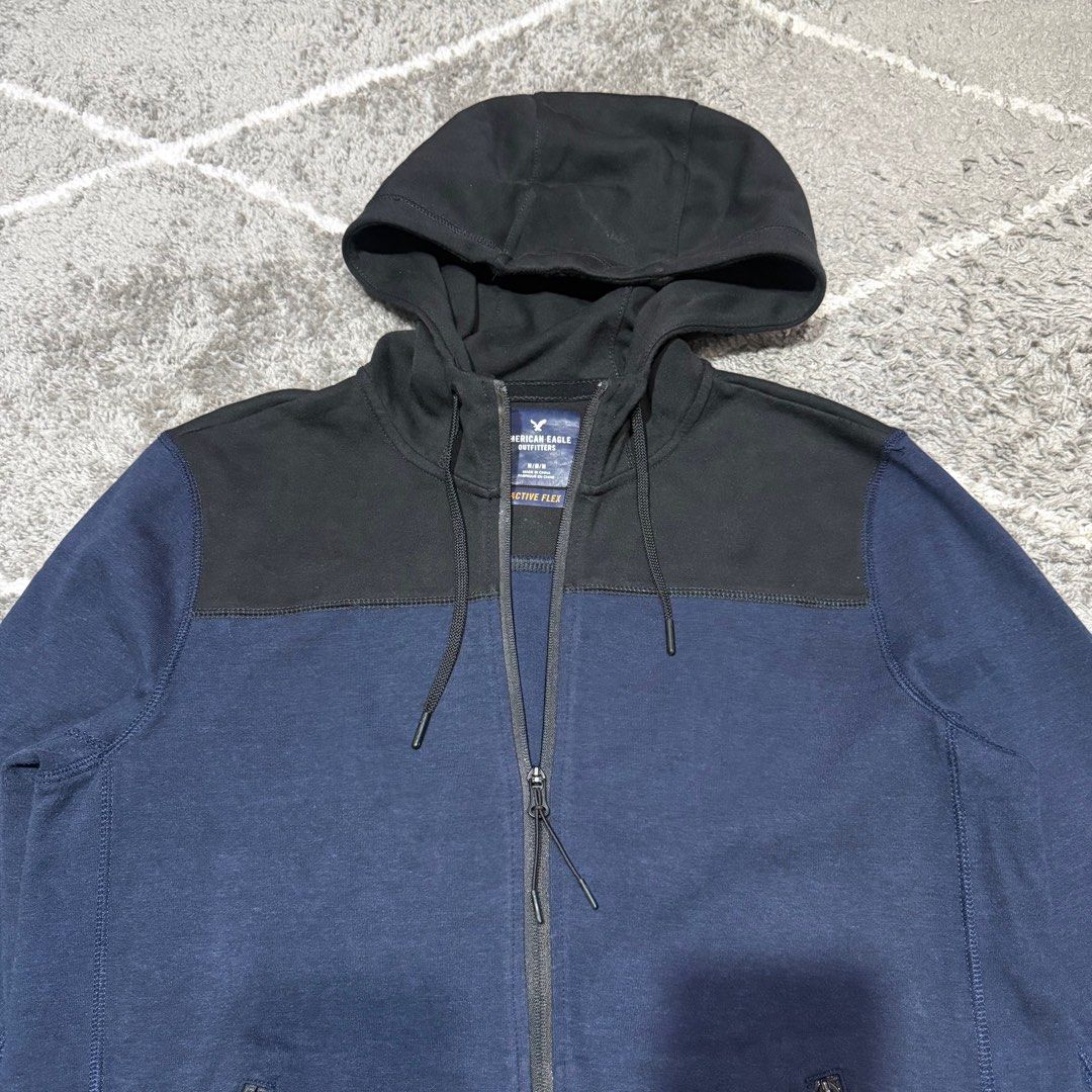 American Eagle Outfitters - Active Flex - Hoodie Jacket (Category: Activewear) located in Paranaque City. Submitted by vic.store.sy (Listing ID 1396575886, Image 2). Description: American Eagle Outfitters - Active Flex - Hoodie Jacket Color: Blue / Black Size: Medium Length: 27” Width: 21” Shoulders: 18” Arms: 26” Issue: none MOP: GCash Shipping fee by buyer.