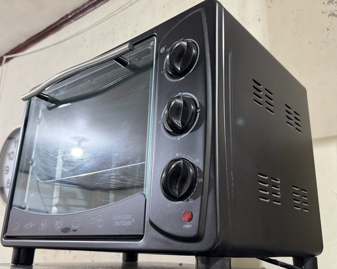 American Heritage Electric Oven 30L (Category: Ovens & Toasters) located in Makati City. Submitted by nik.11 (Listing ID 1396516359, Image 1). Description: Moving out sale: not using it anymore. - American Heritage electric oven - Multiple settings for baking and toasting - Glass door for easy food viewing - Includes timer and temperature control - Compact design - Black exterior.