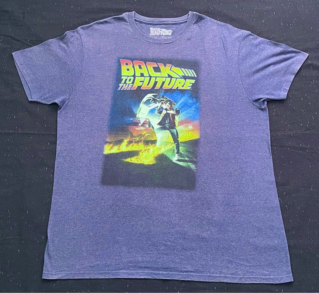 Back To The Future Navy Blue Shirt (Category: Tshirts & Polo Shirts ) located in Bay. Submitted by thrift2memorylane (Listing ID 1396586827, Image 1). Description: Back To The Future Navy Blue Shirt Color rate: 9/10 Condition: Good Size: XL on tag (31.5 x 24 in) 300 + sf Location: Laguna Dm Note: Color may vary due to camera and lighting.