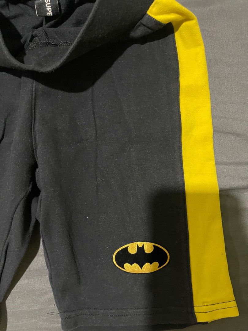 Batman Shorts - Size M (Category: Babies & Kids Fashion) located in Manila. Submitted by _eahmczz (Listing ID 1396657893, Image 3). Description: - Black shorts, size M - Yellow side stripes - Batman logo - Two back pockets with yellow lining and Batman logo - Black waistband.