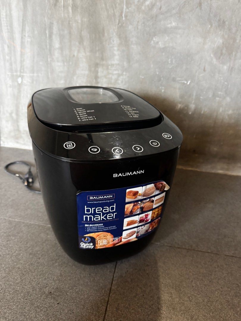 Baumann Digital Bread Maker (Category: Other Kitchen Appliances) located in Quezon City. Submitted by decluttering2472025 (Listing ID 1396526472, Image 2). Description: Bought for almost 7k - Baumann digital bread maker - Multiple settings: basic, french, whole wheat, gluten-free - Quick-ready function - Includes instruction manual - Color: Black - Digital display - In good working condition.