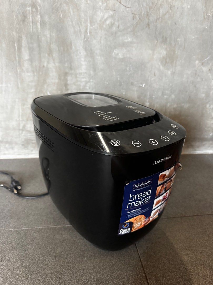 Baumann Digital Bread Maker (Category: Other Kitchen Appliances) located in Quezon City. Submitted by decluttering2472025 (Listing ID 1396526472, Image 1). Description: Bought for almost 7k - Baumann digital bread maker - Multiple settings: basic, french, whole wheat, gluten-free - Quick-ready function - Includes instruction manual - Color: Black - Digital display - In good working condition.