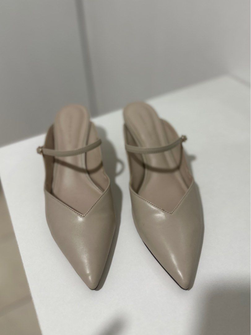 Charles and Keith Pointed Heels/Toe Mules (Category: Flats & Sandals) located in Quezon City. Submitted by nekorobin21 (Listing ID 1396610879, Image 2). Description: - Charles & Keith mules - Neutral beige color - Pointed toe design - Strap detail - Gold heel accent - Perfect for casual and formal wear.