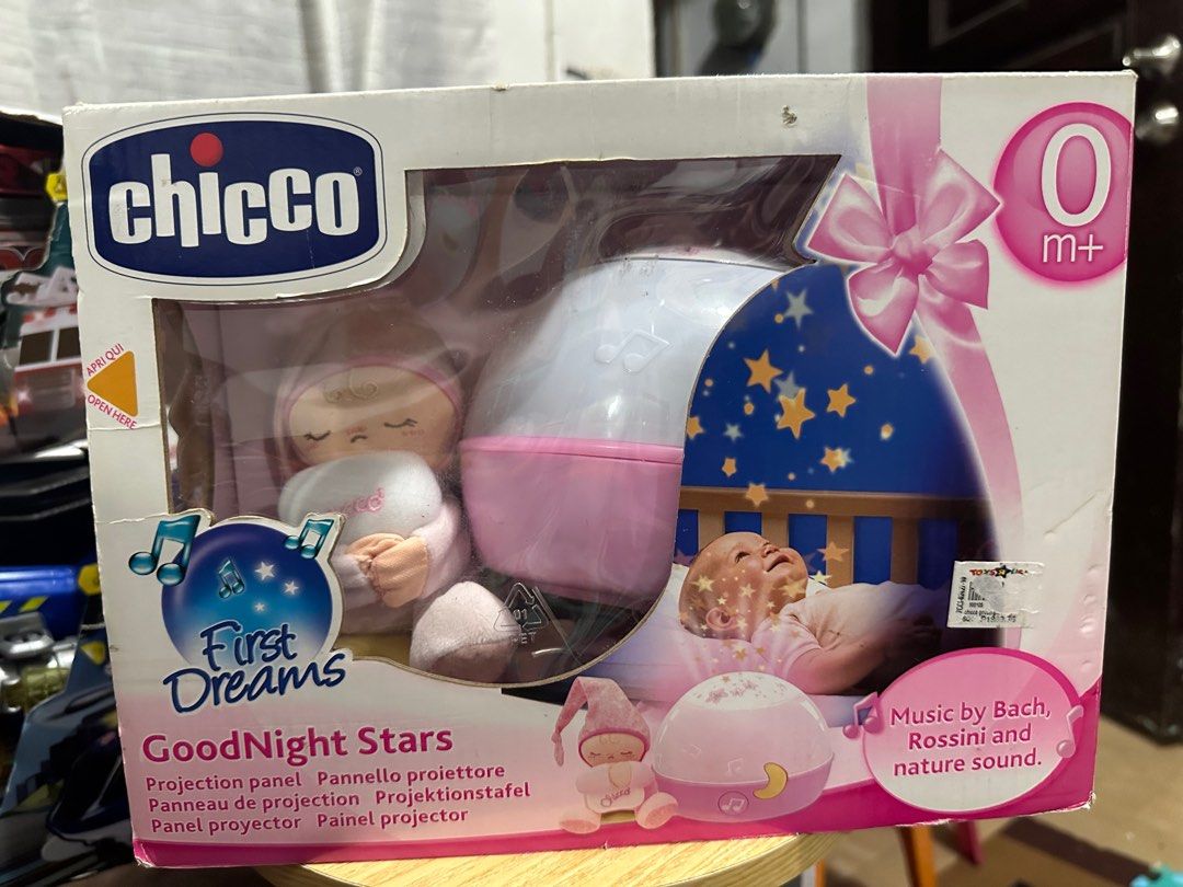 Chicco First Dreams GoodNight Stars Projection Panel (Category: Infant Playtime) located in Manila. Submitted by bei10 (Listing ID 1396531482, Image 1). Description: - Chicco First Dreams GoodNight Stars projection panel. - Features music by Bach, Rossini, and nature sounds. - Suitable for newborns (0m+). - Includes a projection panel and a cute plush toy. - Projects a starry night scene. MALL PRICE 2k.