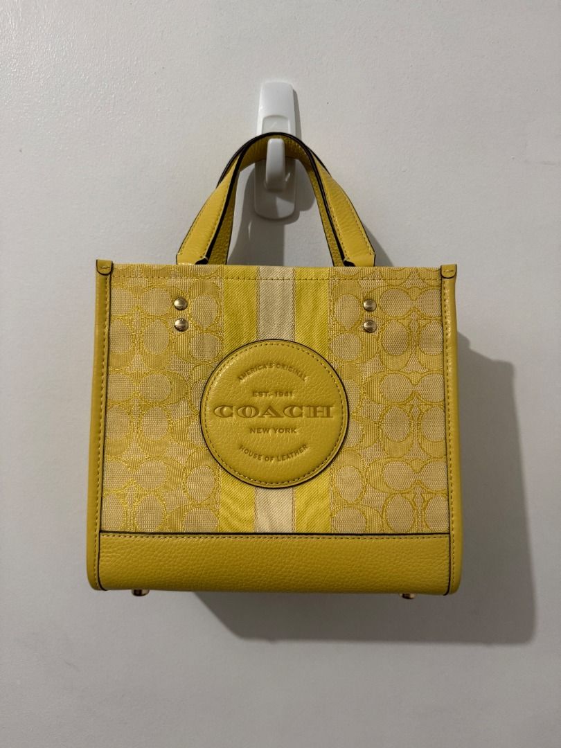 Coach Dempsey Tote 22 - Yellow Multi (Category: Luxury Bags & Wallets) located in Quezon City. Submitted by afpar (Listing ID 1396637414, Image 1). Description: Rarely used.