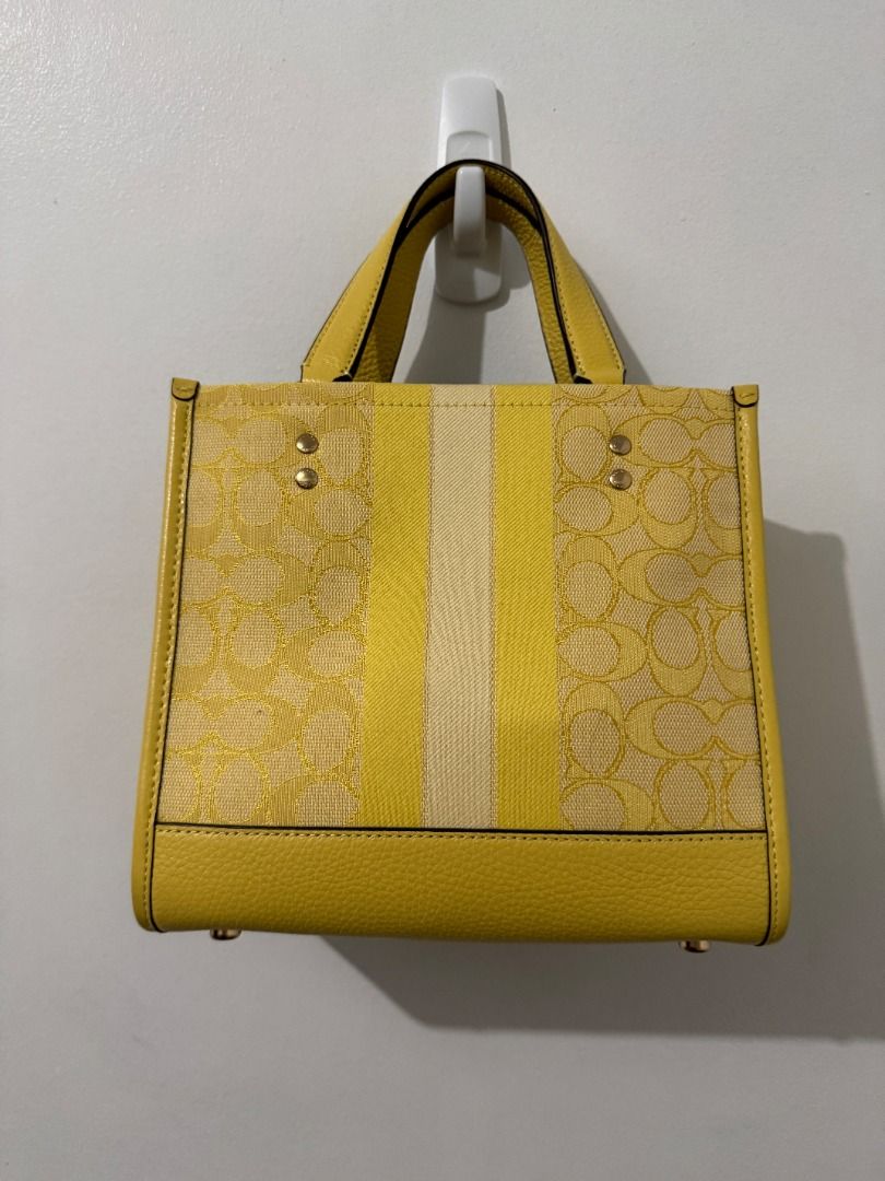 Coach Dempsey Tote 22 - Yellow Multi (Category: Luxury Bags & Wallets) located in Quezon City. Submitted by afpar (Listing ID 1396637414, Image 2). Description: Rarely used.