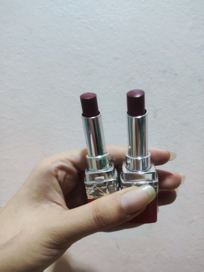 Dior Rouge Dior Lipstick (Category: Makeup) located in Quezon City. Submitted by declutterbyck (Listing ID 1396489522, Image 2). Description: Authentic Dior Rouge Dior lipsticks in a dark reddish-brown shade. Red casing with Dior logo. Square shape with silver base. .