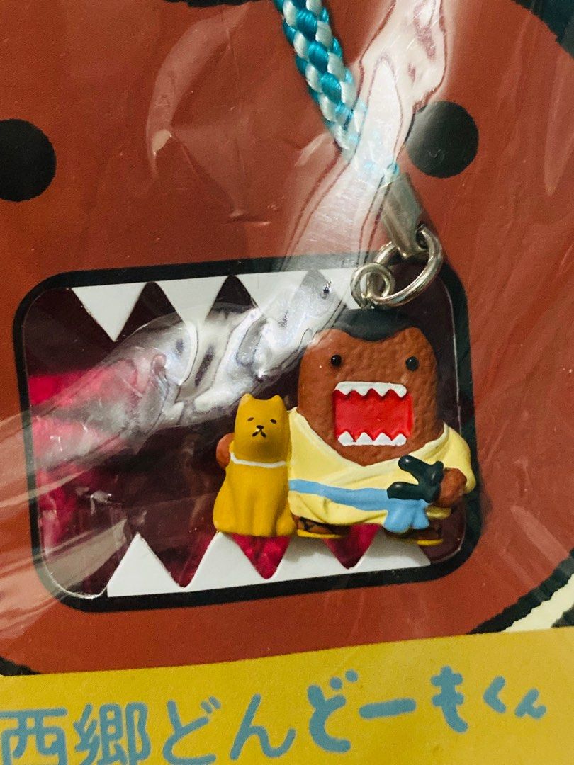 Domo-kun Keychain 250 (Category: Character Goods) located in Zamboanga. Submitted by kawaii_omocha_est2020 (Listing ID 1396638846, Image 2). Description: - Domo-kun keychain - Features Domo-kun in a yellow outfit - Includes a small yellow cat - Attached to a blue and white braided strap - Packaging with Japanese text - Features the NHK-TYO logo - Still in original packaging ✅Mine now/ Pay now ✅ Please scan all photos for more details. ✅ Manage yo