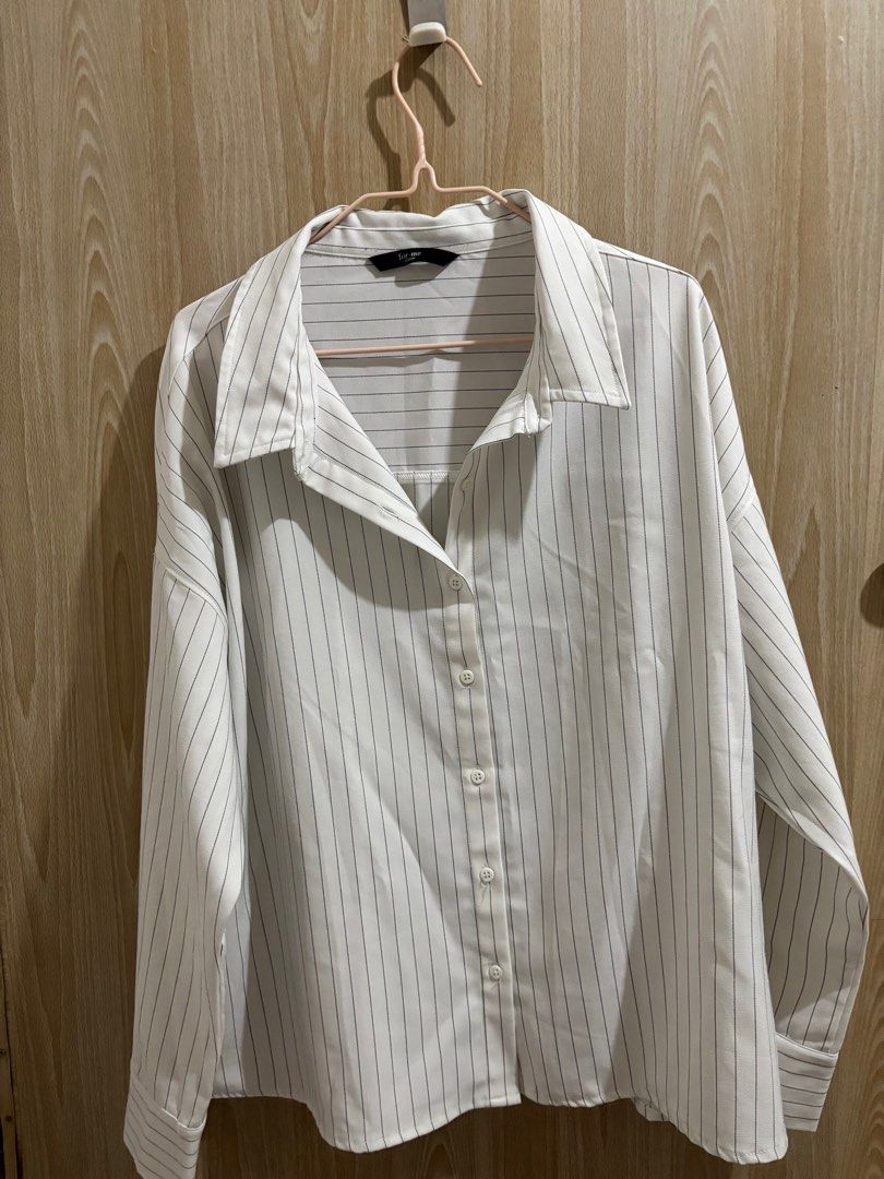 For Me Striped Button-Down Shirt (Category: Longsleeves) located in Balanga. Submitted by pmcgee (Listing ID 1396649111, Image 1). Description: - Brand: For Me (bought for 1k+) - Worn once, can pass as brand new - Style: White button-down shirt with thin black stripes - Features: Collared neckline, long sleeves with buttoned cuffs - Fit: Relaxed oversize - Material: Lightweight fabric .