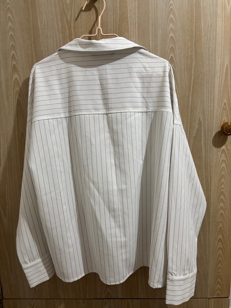 For Me Striped Button-Down Shirt (Category: Longsleeves) located in Balanga. Submitted by pmcgee (Listing ID 1396649111, Image 2). Description: - Brand: For Me (bought for 1k+) - Worn once, can pass as brand new - Style: White button-down shirt with thin black stripes - Features: Collared neckline, long sleeves with buttoned cuffs - Fit: Relaxed oversize - Material: Lightweight fabric .
