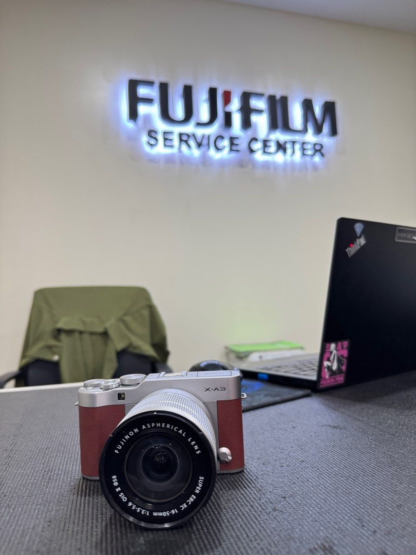 Fujifilm X-A3 Mirrorless Camera with Lens (Category: Cameras) located in Makati City. Submitted by nik.11 (Listing ID 1396527794, Image 2). Description: - Fujifilm X-A3 mirrorless camera - Includes XC 16-50mm f/3.5-5.6 OIS II lens - Silver body with brown accents - Camera shown at Fujifilm Service Center - Made in the Philippines - Includes camera body and lens.