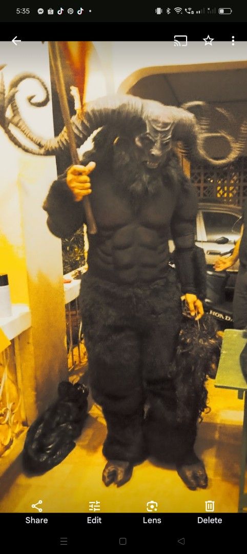 Halloween kapre costume (Category: Sets & Coordinates) located in Quezon City. Submitted by gonocampoart (Listing ID 1396638733, Image 1). Description: - Detailed goat mask with large horns - Black furry bodysuit - Matching hooves - Includes staff and detached fur piece - Dark and imposing design - Ideal for Halloween or themed events - Designed for average height.