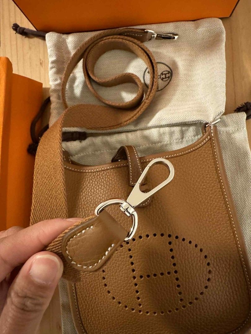 Hermes Evelyne TPM Bag (Category: Luxury Bags & Wallets) located in Bacoor. Submitted by angelguanco (Listing ID 1396493724, Image 2). Description: - Authentic Hermes Evelyne TPM bag - Color: Brown - Includes: Original box, dust bag, and strap - Iconic perforated "H" design - Detachable strap - Spacious interior - Made in France used once 9.8/10 like new.