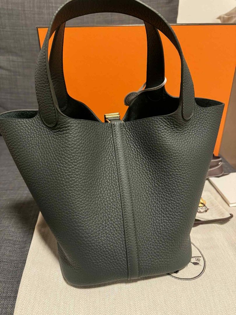 Hermes Picotin 22 Handbag (Category: Luxury Bags & Wallets) located in Bacoor. Submitted by angelguanco (Listing ID 1396493014, Image 3). Description: - Authentic Hermes Picotin 22 - Dark grey color - Includes padlock closure - Complete inclusions with receipts - Comes with original box and dust bag - Classic tote design - Structured shape.