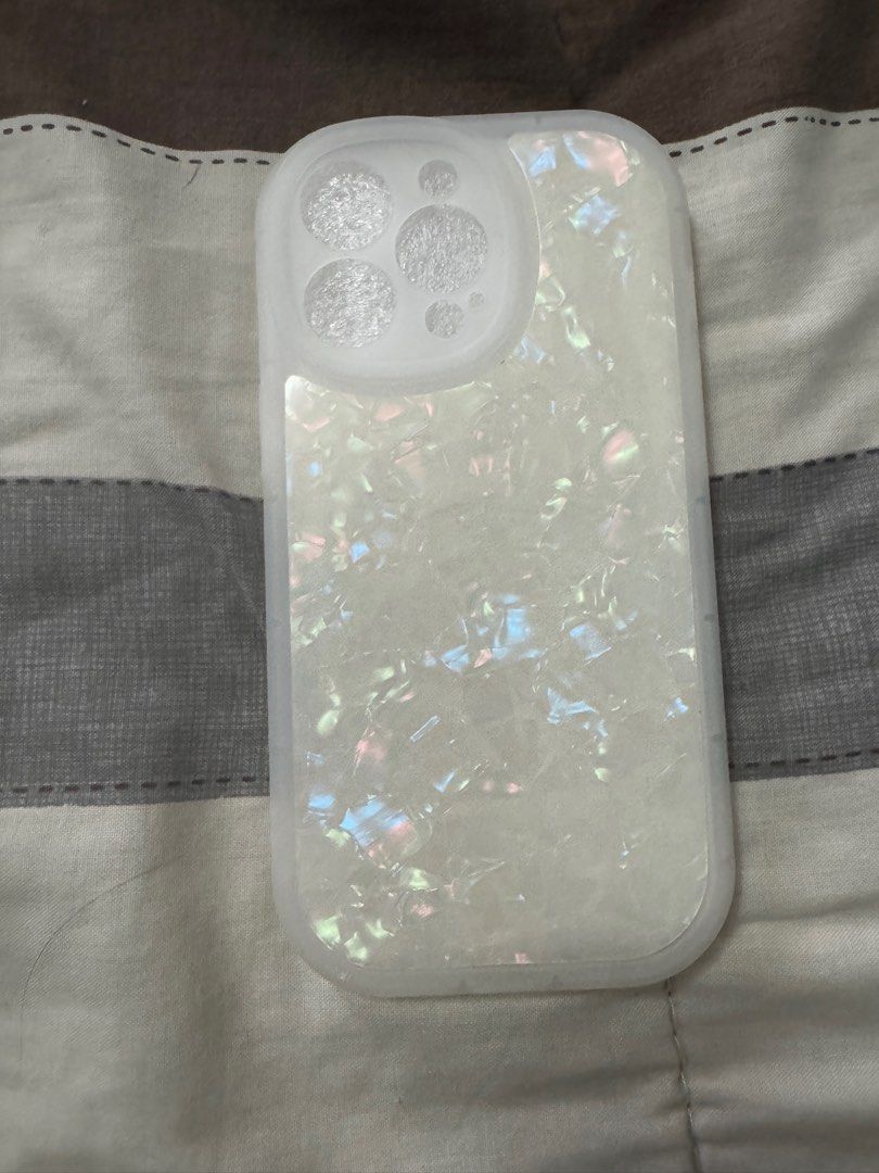 iPhone 11 Pro Case Set - White (Category: Cases & Sleeves) located in Quezon City. Submitted by amdeclutter (Listing ID 1396544800, Image 3). Description: - Set of four white textured iPhone cases. - Includes the following designs: - Pearlescent finish - Quilted design - Smooth wavy design - Smooth, curved design - All cases have camera openings..