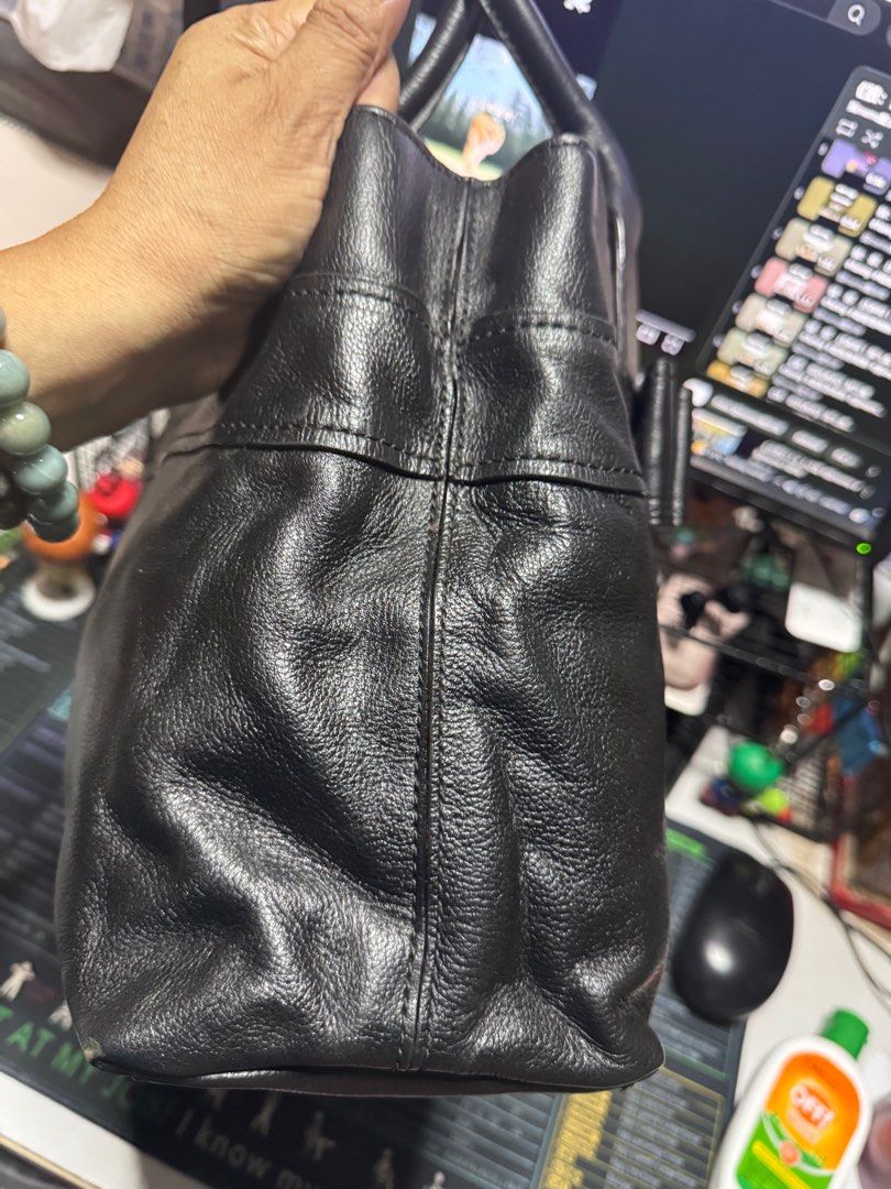 Kate Spade Black Leather Handbag (Category: Luxury Bags & Wallets) located in Taytay. Submitted by jp4_fashion_hub (Listing ID 1396525850, Image 3). Description: - Kate Spade black leather handbag - Bow detail on the front - Spacious interior with multiple pockets - Diamond-patterned interior lining - Zipper closure - Dual top handles - Kate Spade logo visible - Authentic.