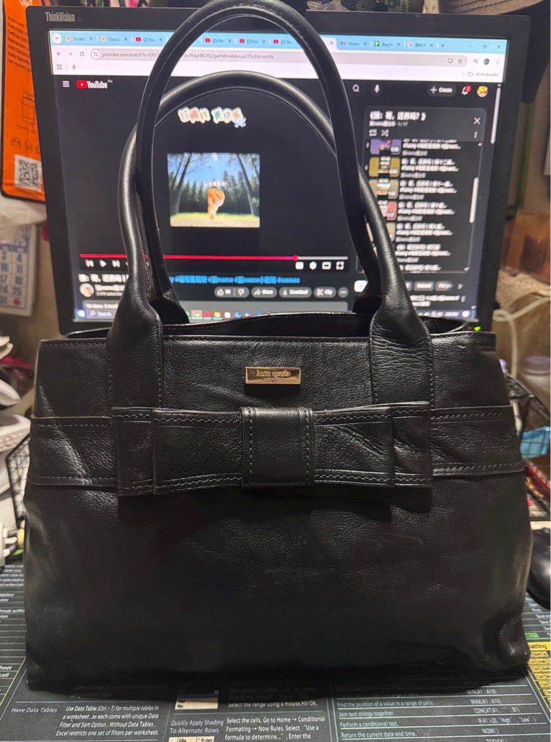 Kate Spade Black Leather Handbag (Category: Luxury Bags & Wallets) located in Taytay. Submitted by jp4_fashion_hub (Listing ID 1396525850, Image 1). Description: - Kate Spade black leather handbag - Bow detail on the front - Spacious interior with multiple pockets - Diamond-patterned interior lining - Zipper closure - Dual top handles - Kate Spade logo visible - Authentic.